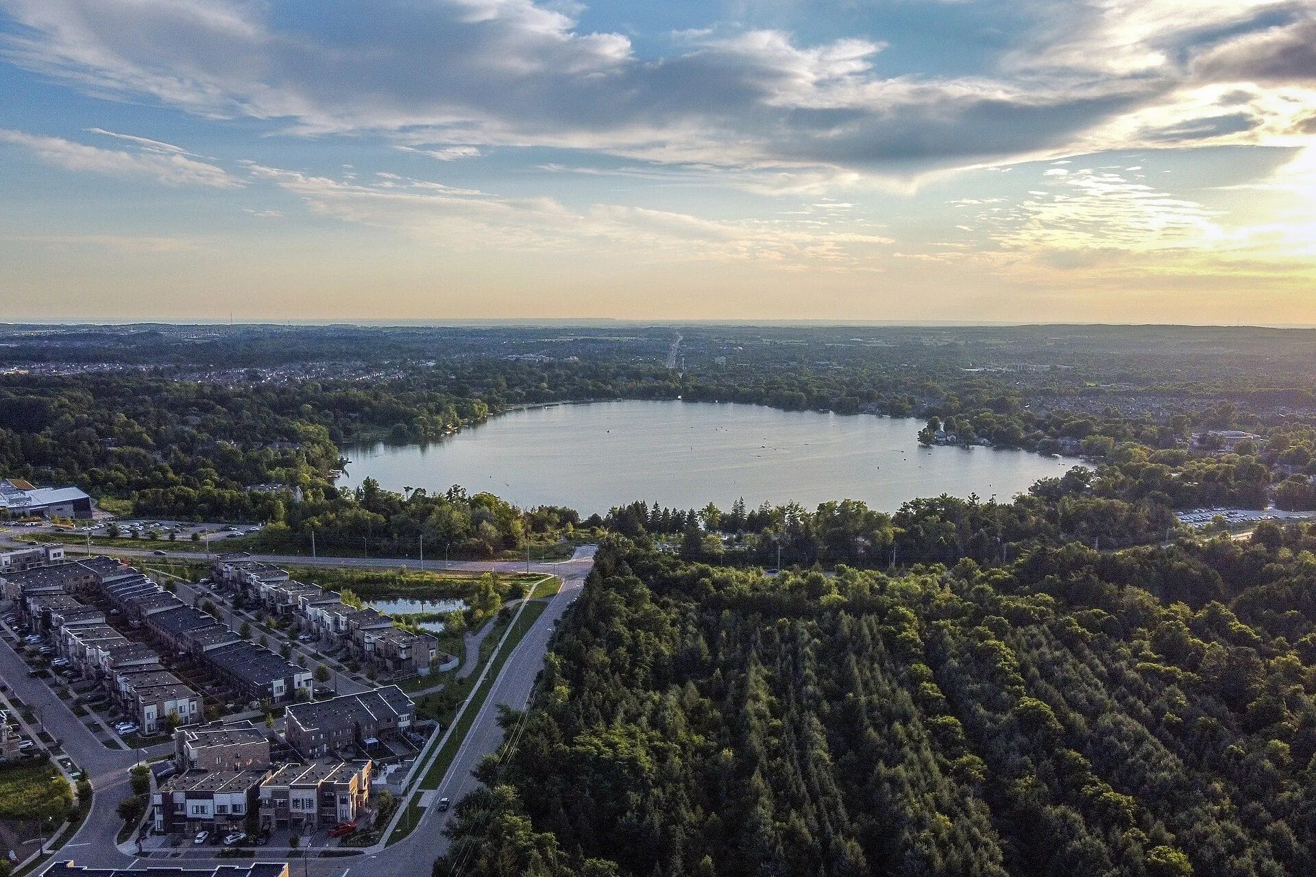 Lake Wilcox at sunset with new townhomes in the foreground, Richmond Hill