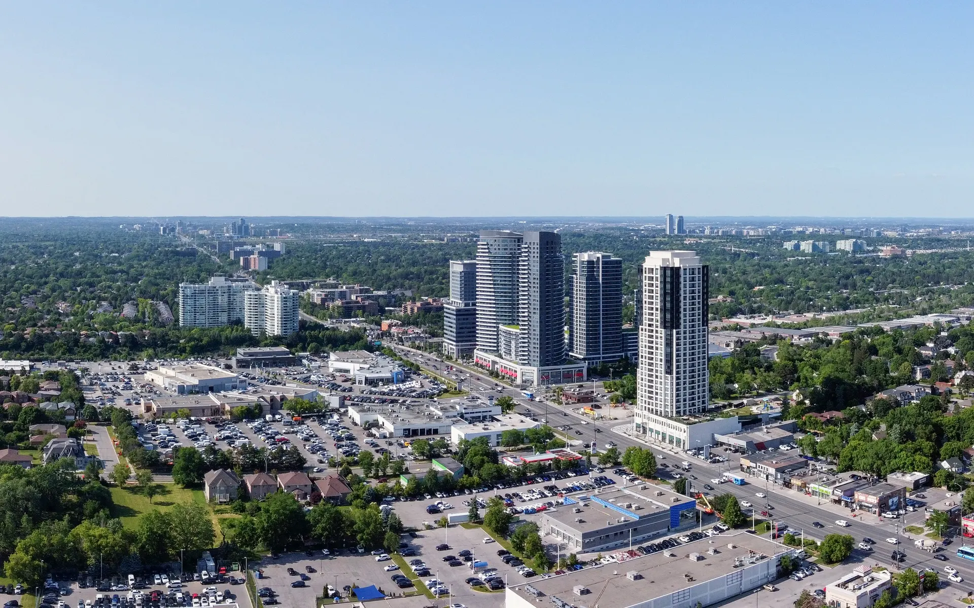 Aerial view east from Yonge and Steeles over the tree-lined streets of the Markham side of Thornhill
